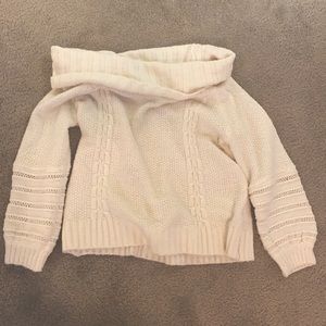 Off the shoulder, white sweater.